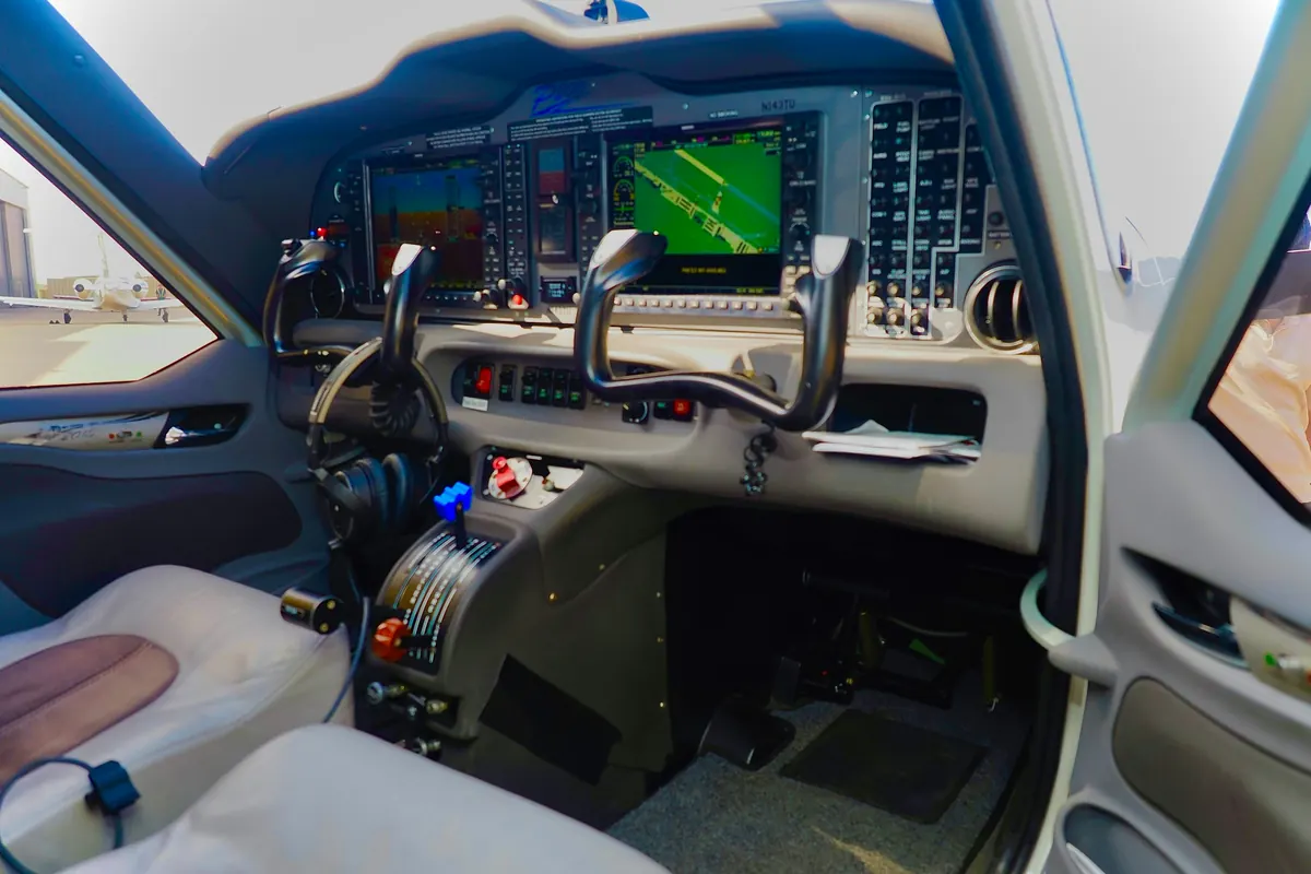 Cockpit of a turboprop business aircraft with control yokes and glass displays